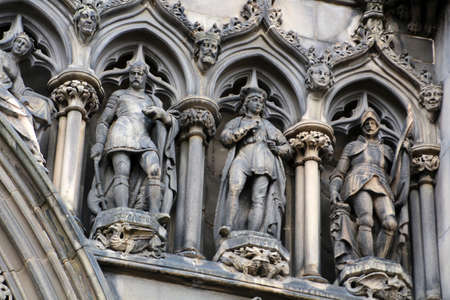 Sandstone figures at the entrance to St. Giles Cathedral, also known as the High Kirk of Edinburgh, Scotlandの写真素材