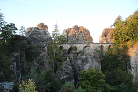 View to Bastei Bridge at sunrise, Bastei Saxon Switzerland, Germanyの写真素材
