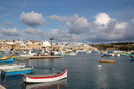 View of colorful fishing boats in Marsaxlokk harbor, Maltaの写真素材