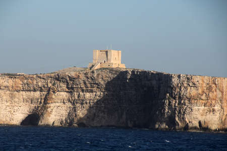 Cliffs of Comino Island, Malta. Comino is the smallest inhabited island in the Maltese archipelago. Politically it belongs to the Republic of Malta.の写真素材