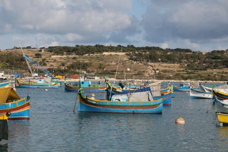 View of colorful fishing boats in Marsaxlokk harbor, Maltaの写真素材