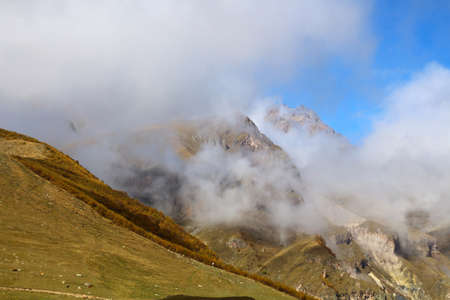 Landscape in the Greater Caucasus seen from Gergeti Trinity Church towards Mount , Georgiaの写真素材