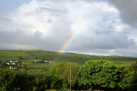 Rainbow in the Tralee countryside in County Kerry, Irelandの写真素材