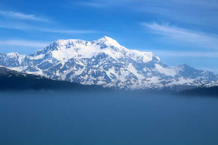 Rising from the mist is Mount Saint Elias, the fourth highest mountain in North America, Alaskaの写真素材