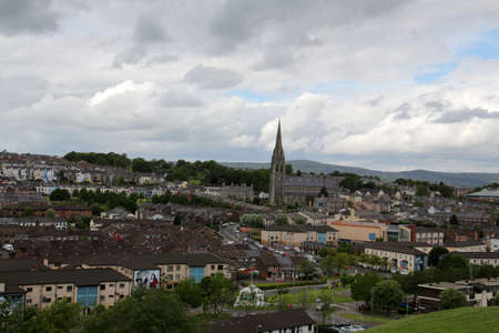 View of Derry - Londonderry with St Eugene's Cathedral in the background, Northern Irelandの写真素材