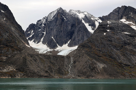 Mountain range in a bay of the Kangerlussuaq fjord Greenland, Denmarkの写真素材