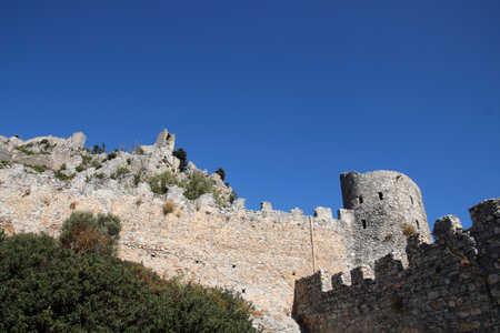 Remains of the castle wall with watchtower of the ruins of the crusader castle of St Hilarion, North Cyprusの写真素材