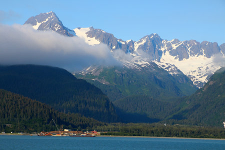 Mountain range in the Resurrection Bay seen from the port of Seward, Alaskaの写真素材