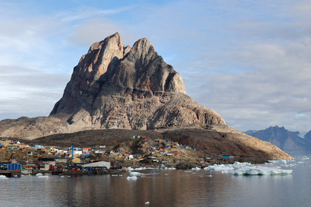 View of the Greenlandic town of Uummannaq with its distinctive rockの写真素材