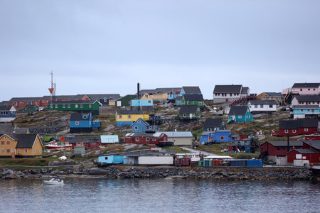 View of the colorful houses on the coast of Qeqertarsuaq, Greenland, Denmarkの写真素材