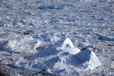 Jakobshavn Glacier also known as Ilulissat Glacier or Sermeq Kujalleq seen from an airplaneの写真素材