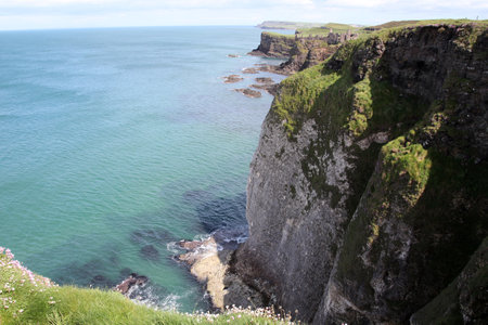 Rugged north coast at Dunluce Castle in Northern Irelandの写真素材