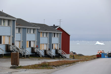Street with a row of houses in the small town of Illulissat, Greenland, Denmarkの写真素材