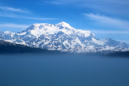 Rising from the mist is Mount Saint Elias, the fourth highest mountain in North America, Alaskaの写真素材
