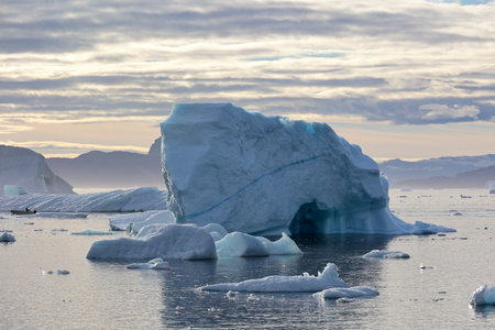 Sea voyage in the Uummannaq fjord with huge icebergs, Greenland, Denmarkの写真素材