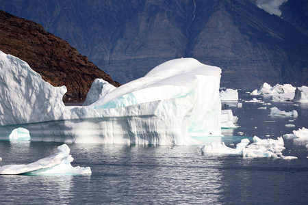 Sea voyage in the Uummannaq fjord with huge icebergs, Greenland, Denmarkの写真素材