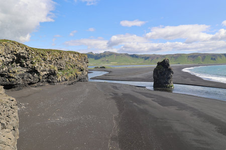 Dyrholaey Peninsula, fantastic coastline with black sand beach-Icelandの写真素材