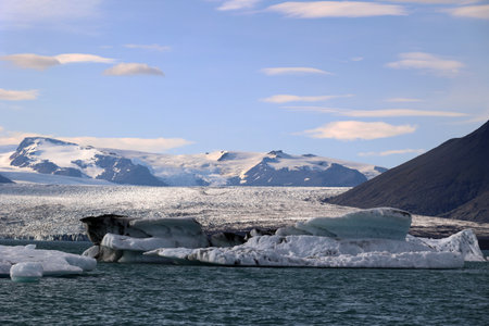 Iceberg in Jokulsarlon Glacier Lagoon with the Vatnajokull glacier in the background - Icelandの写真素材