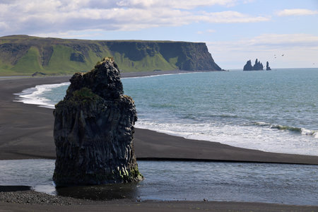 Rock needle Dyrholaey peninsula fantastic coastal landscape-Icelandの写真素材