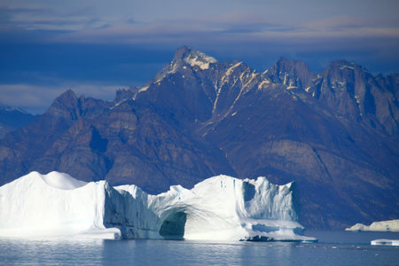 Arctic, iceberg with hole in Uummannaq fjord, Greenland, Denmark