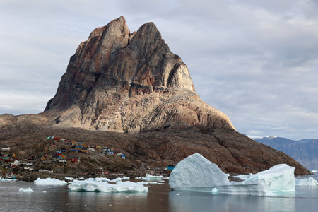 View of the Greenlandic town of Uummannaq with its distinctive rockの写真素材