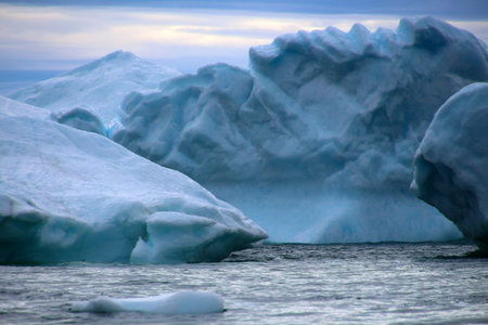 Close-up of an iceberg in Ilulissat Icefjord with dramatic sky in Disko Bay, Greenland, Denmark