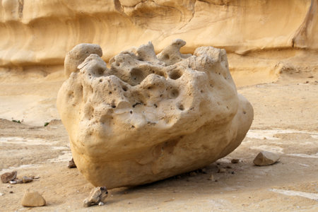 Sandstone boulders cliffs on the eroded coast of Xlendi, Gozo, Maltaの写真素材