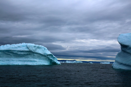 Arctic Icebergs in Ilulissat Icefjord in Disko Bay on the western coast of Greenlandの写真素材