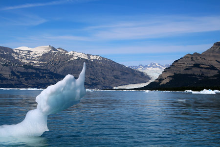 Iceberg in Icy Bay in the background of Mount Saint Elias, Alaska, USAの写真素材