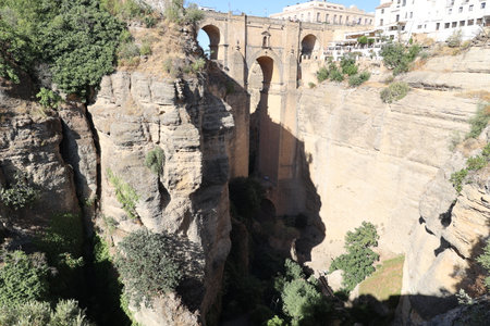 View of the Puente Nuevo - New Bridge - is a bridge structure in the city of Ronda in the Andalusian province of Malaga in southern Spainの写真素材