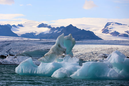 Iceland iceberg in JÃ¶kulsÃ¡rlÃ³n glacier lagoon with VatnajÃ¶kull National Park in the...