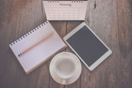 Calendar 2021 assignments with blank notes for making lists on the old wooden table.の写真素材