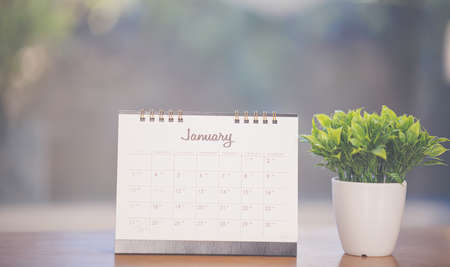 Month January in 2021 paper calendar on the wooden tableの写真素材