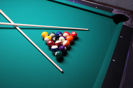 Pool Table - Crossed Cues A game of 8 Ball, racked and ready to go 