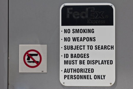 Indianapolis: Circa June 2016: No Smoking No Weapons Sign at a Federal Express Location. FedEx is a Worldwide Delivery Company Xのeditorial素材