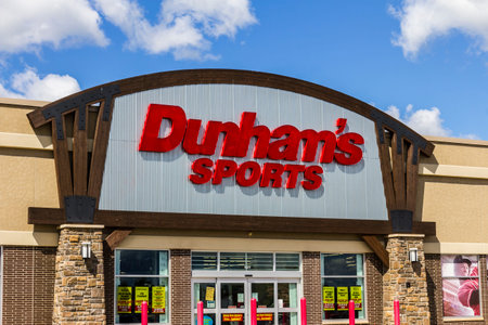 Muncie - Circa September 2016: Dunham's Sports Retail Strip Mall Location. Dunham's Sports is a...