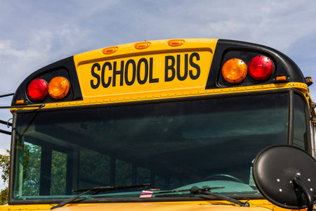 Kokomo - Circa October 2016: Yellow School Buses in a District Lot Waiting to Depart for Students...