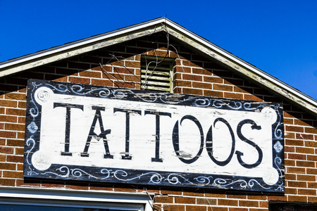 Worn and Faded Tattoo Shop Sign Iの写真素材