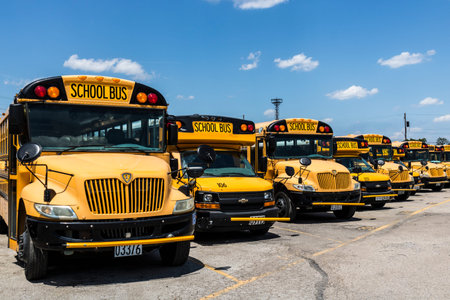 Cincinnati - Circa May 2017: Yellow School Buses in a District Lot Waiting to Depart for Students...