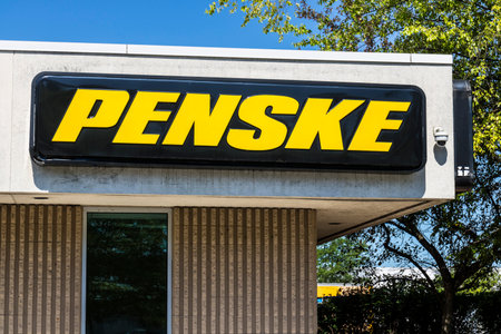 Indianapolis - Circa July 2017: Logo and signage of Penske Truck Leasing. Penske leases trucks, owns racing teams and auto dealerships Iのeditorial素材