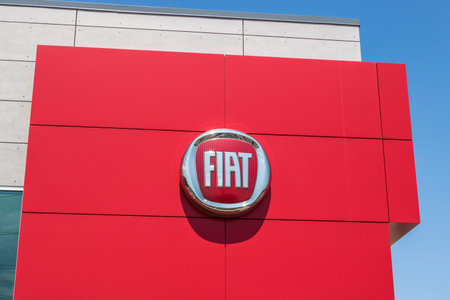 Indianapolis - Circa August 2017: Logo and signage of local Fiat dealership. Fiat is part of FCA and...