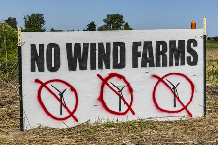 As Wind Farms become more popular, many people do not want wind turbines in their neighborhoods due to noise and shadow flicker Iの写真素材