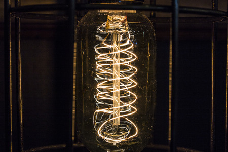 Vintage antique filament light bulb. Lightbulb for background or abstract Iの写真素材