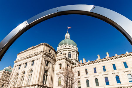 Indianapolis - Circa March 2018: Dale Enochs Time Flow framing the Indiana State House. Part of the Indiana State House Public Art Collection IIのeditorial素材