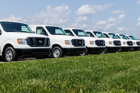 Fishers - Circa August 2018: A fleet of Nissan NV Cargo Trucks. Nissan is part of the...