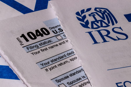 Indianapolis - Circa March 2019: New IRS 1040 Tax forms. The new 1040 forms are simplified from...