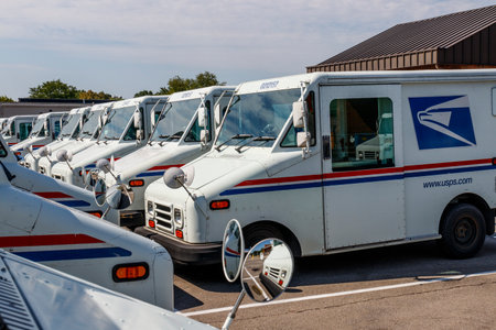 Indianapolis - Circa August 2019: USPS Post Office Mail Trucks. The Post Office is responsible for providing mail delivery IXのeditorial素材