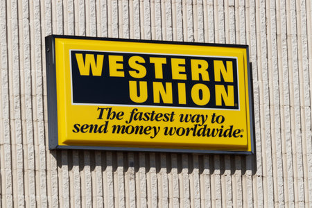 Kokomo - Circa September 2019: Western Union signage and logo. Western Union sent telegrams over telegraph and now offers wire transfers, money orders and money transfersのeditorial素材