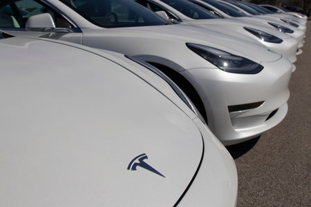 Indianapolis - Circa April 2020: Tesla electric vehicles awaiting preparation for sale. Tesla EV...
