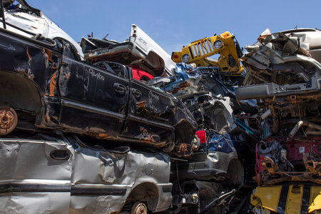 Indianapolis - Circa May 2020: Junk cars that have been crushed and stacked. The remains will be recycled, salvaged or sold for parts.のeditorial素材